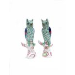 A pair of Herend porcelain figures of owls perched on tree stumps, 13.25cm high, (2).