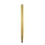 A Cartier propelling pencil of ribbed cylindrical form, 14.5cm long, stamped 'Cartier' London 18ct.