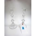 A set of three facet cut glass candlesticks, 20th century, each 23cm high,