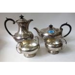 A silver four piece tea service, Walker & Hall, Sheffield 1930 & 1931,