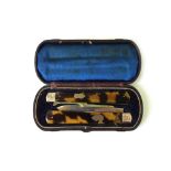 A Victorian silver gilt folding fruit knife and fork, makers mark T.M.