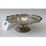 A late Victorian silver cake basket, Walker & Hall, Sheffield 1899, in George IV style,