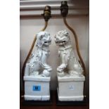 Two Chinese blanc de chine Buddhistic lion dogs, later mounted as table lamps,