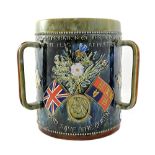 A large Doulton Lambeth three handled loving cup or tyg,