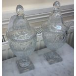 A pair of Regency style glass vase shape honey jars and covers, circa 1900, 31cm high.