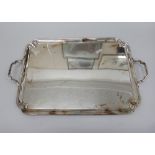 An Art Deco electroplate two handled rectangular tea tray, 59cm across.