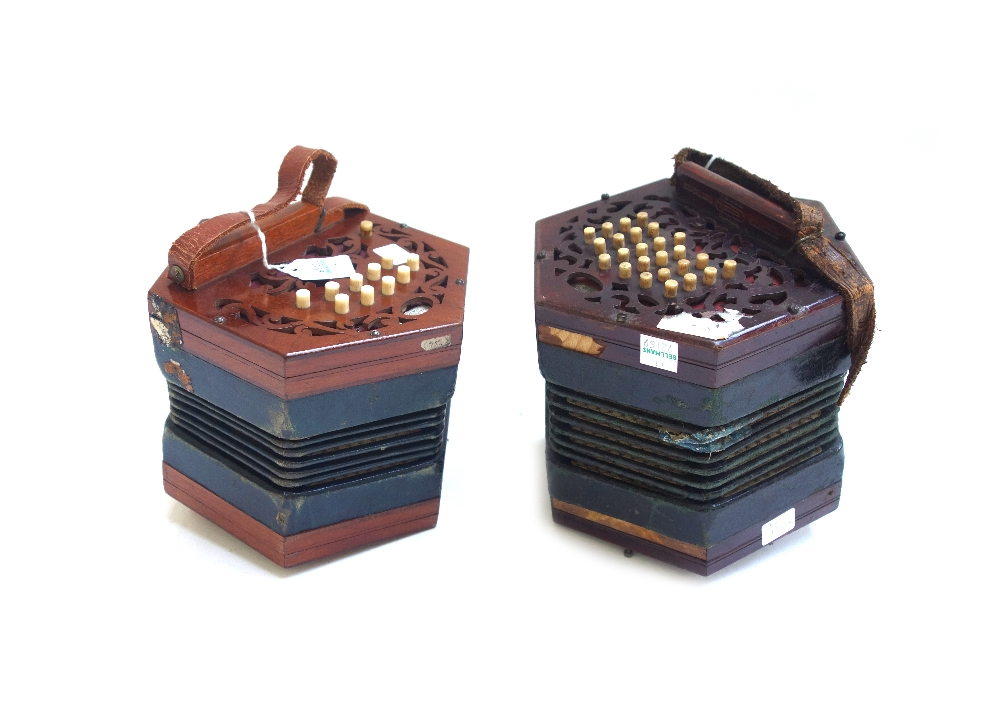 A Lachenal & Co concertina, 19th century, with forty seven bone buttons on pierced mahogany ends,