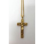 A 9ct gold pendant crucifix, with a 9ct gold faceted curb link neckchain, on a boltring clasp,