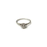 A diamond set single stone ring, claw set with a cushion shaped diamond, ring size L and a half,