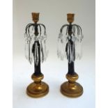 A pair of patinated and gilt bronze figural candlestick lustres,