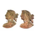 A pair of modern plaster classical profile busts painted in imitation of terracotta,