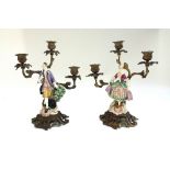 A pair of bronze and porcelain mounted figural three branch candelabra, 19th century,