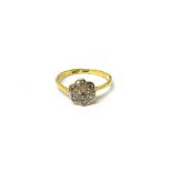 An 18ct gold and platinum, diamond set seven stone cluster ring,