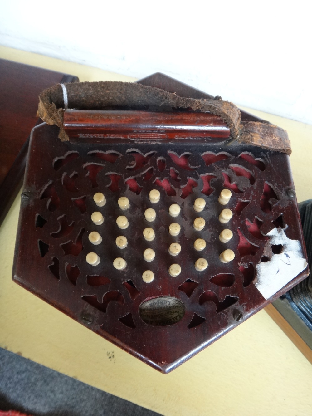 A Lachenal & Co concertina, 19th century, with forty seven bone buttons on pierced mahogany ends, - Image 4 of 11