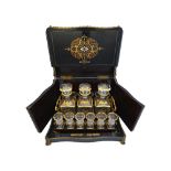 A French brass and tortoiseshell 'Bouille' inlaid ebonised decanter case, circa 1870,
