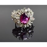 A magenta sapphire and diamond set cluster ring,