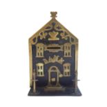 A Victorian black painted metal and brass money box, modelled as a bank, dated 1864, 20cm high.