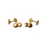 A pair of 9ct gold cufflinks, with dished circular plain backs and fronts,