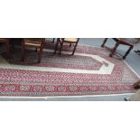 A part silk Kashan carpet, Persian, the plain ivory field with an elongated herate medallion,