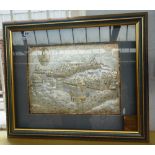 A silvered coloured metal Himalayan temple scene presented to H Goldie, framed and glazed,