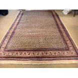 A Saraband carpet, Persian, the ivory field with allover boteh design, a complementary border,