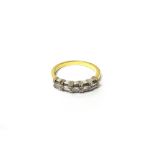 An 18ct gold and diamond set five stone ring,