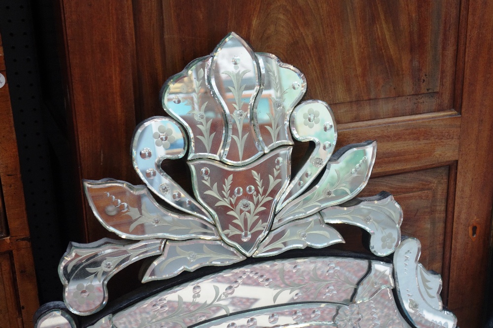 A pair of 20th century cut and etched Venetian glass wall mirrors, each of shield shape outline, - Image 2 of 4