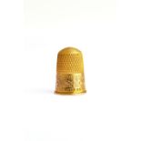 A 15ct gold thimble, with floral, foliate and scroll engraved decoration, Birmingham 1903, weight 5.