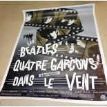 A large Beatles poster of 'A Hard Day's Night', French edition, linen backed.