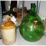 A green glass demijohn and a stoneware jar, (2).