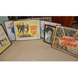 A group of seven mid-20th century posters, some under glass.