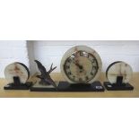 An Art Deco onyx and black slate mantel clock garniture,