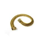 A European gold bracelet, in a multiple link design, on a snap clasp, detailed 750, weight 13.2 gms.