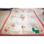 An Aubusson carpet, the ivory field with a delicate cartouche of abundant floral bouquets,