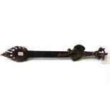 A Tibetan ceremonial bronze and steel 'flaming sword' with dragon head cast handle and flaming tip,