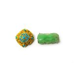 A carved jade brooch, decorated and pierced with a fruit motif and a gold and turquoise set brooch,