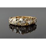 A gold and diamond five stone ring, circa 1900, mounted with a row of cushion shaped diamonds,