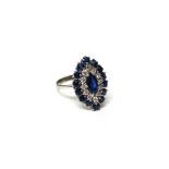 A 14ct white gold, sapphire and diamond marquise shaped cluster ring,