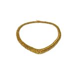 A European gold necklace, in a graduated multiple link design, on a snap clasp, with a safety catch,