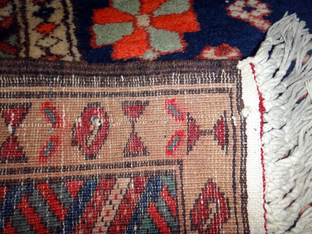 A Karajah runner, Caucasian, the indigo field with six bold hooked diamonds, minor motifs, - Image 5 of 7