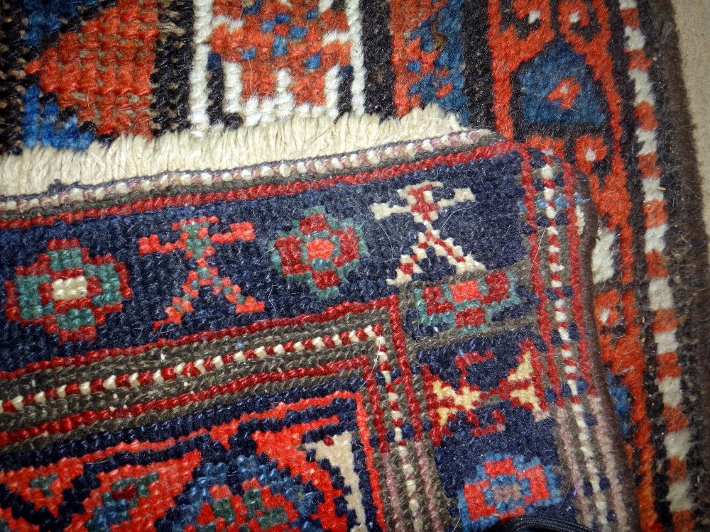 A Fereghan runner, Persian, the dark indigo field with rows of madder botehs, minor botehs, - Image 3 of 7