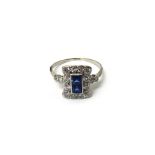 A sapphire and diamond ring, in a rectangular panel shaped design,