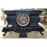 A late 19th century French black slate cased mantel clock,