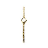 A lady's 18ct gold circular cased wristwatch, with a gilt jewelled lever movement,