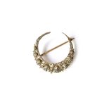 A Victorian gold backed and silver set diamond brooch, designed as a crescent,