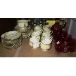 A Royal Albert tea set, and a quantity of cranberry glassware including a decanter (qty).