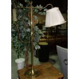 A 20th century brass adjustable floor lamp.