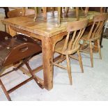 A 19th century pine farmhouse table on block supports and H-framed stretcher, 153cm wide.