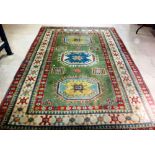 A Turkish carpet of Caucasian design, 310cm x 217cm.