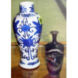 A small Japanese cloisonné vase decorated with a dragon on a midnight blue ground, 15.5cm.